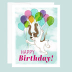 Birthday card with a dog holding balloons and 'Happy Birthday!' text on a light blue background.