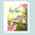 Card with two birds on a branch and pink flowers, with 'hey there' text.