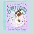 Birthday card with cartoon dog holding ice cream and colorful text on a light blue background.