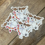 Set of cartoon dog as cupid stickers on a wooden surface