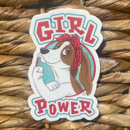 Sticker with a dog wearing a bandana and 'Girl Power' text on a woven background.