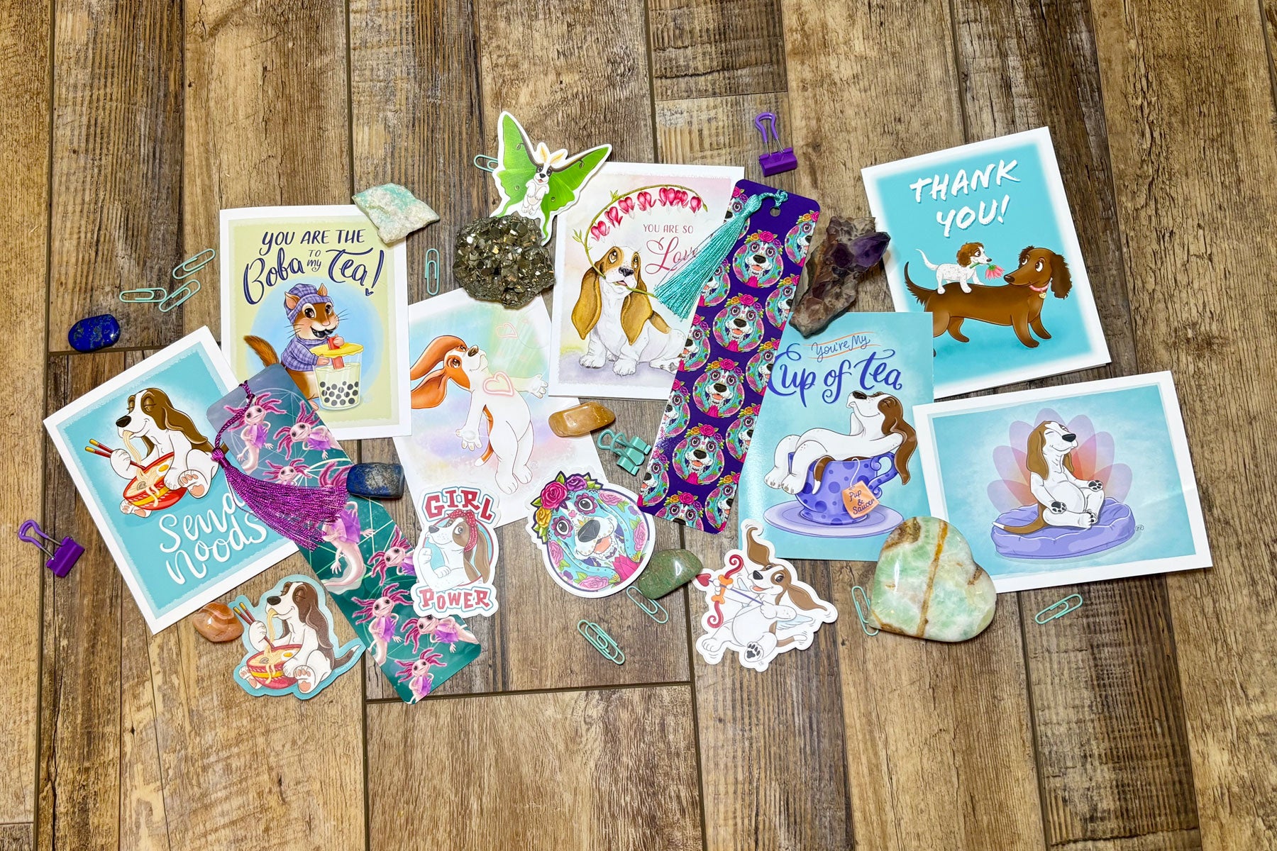 Collection of decorative stickers with cartoon characters on a wooden surface. ©Good Dharma Design, Zoe Ranucci