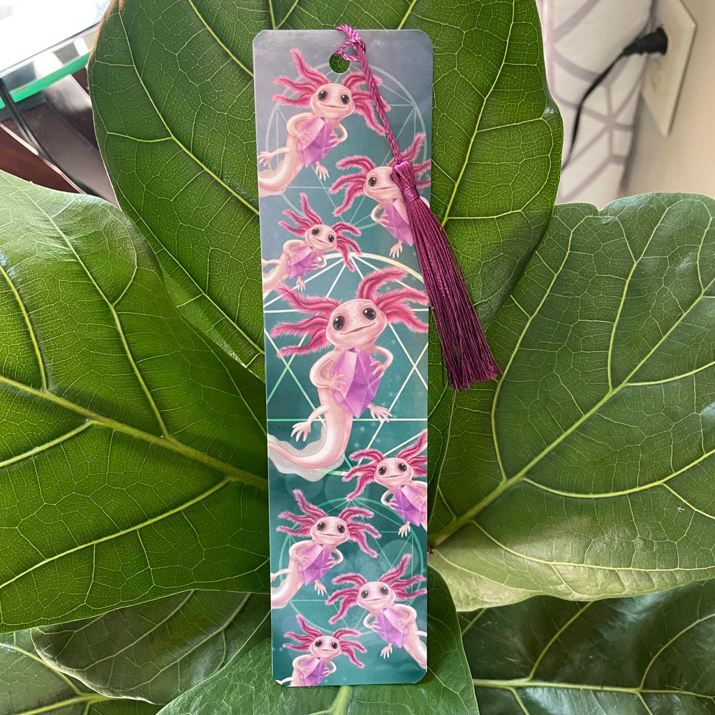 Bookmark with axolotl design on a green leaf background