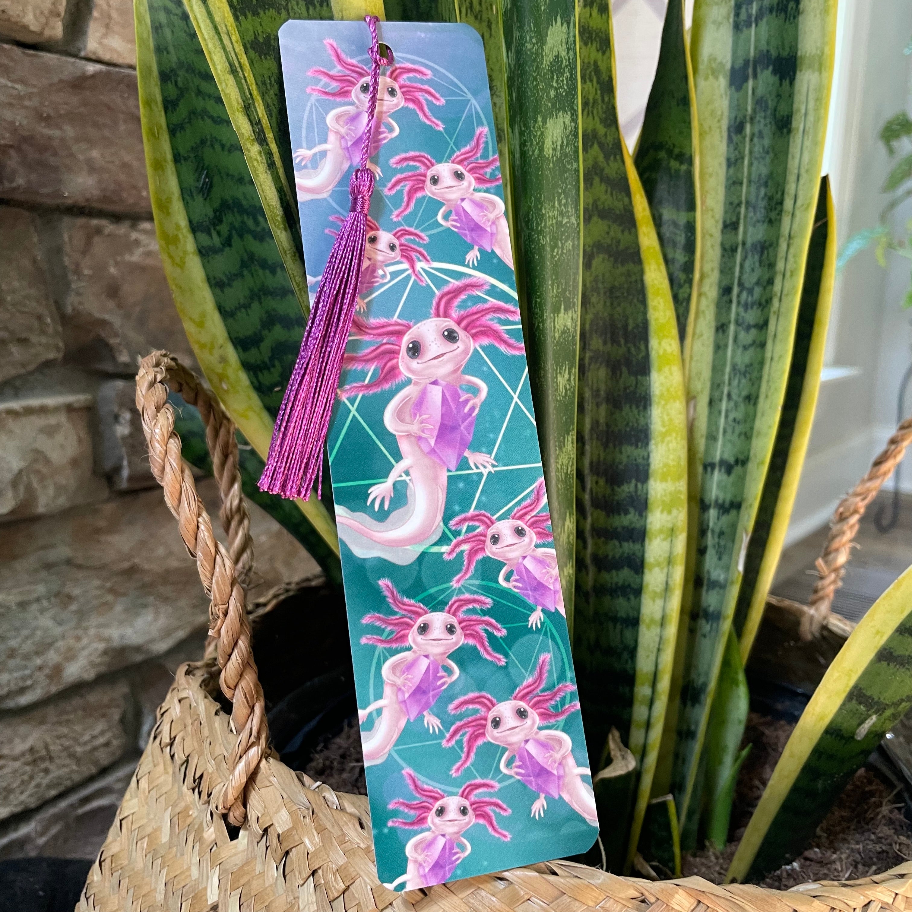 Colorful bookmark with axolotl design on a plant