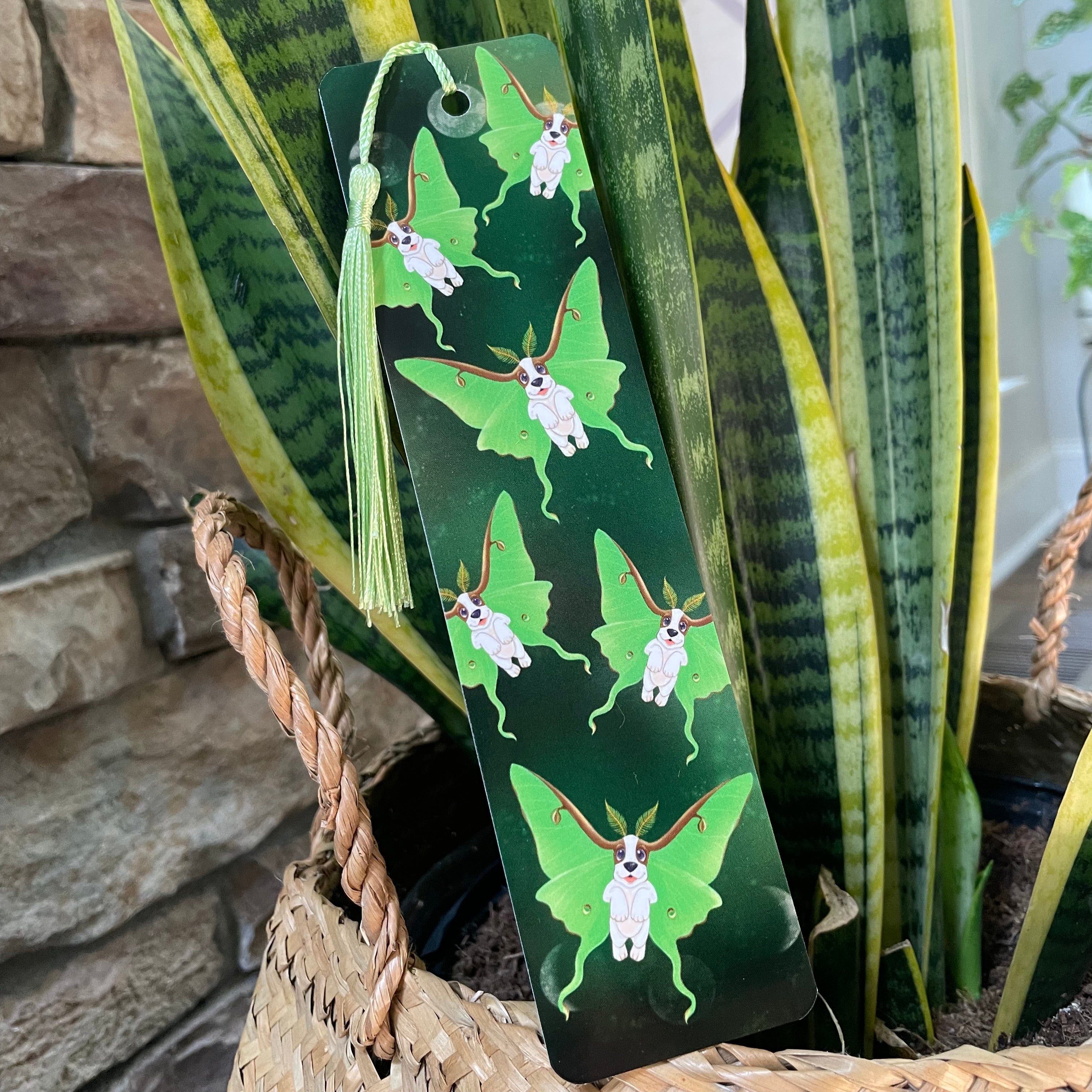 Green bookmark with butterfly design on a plant