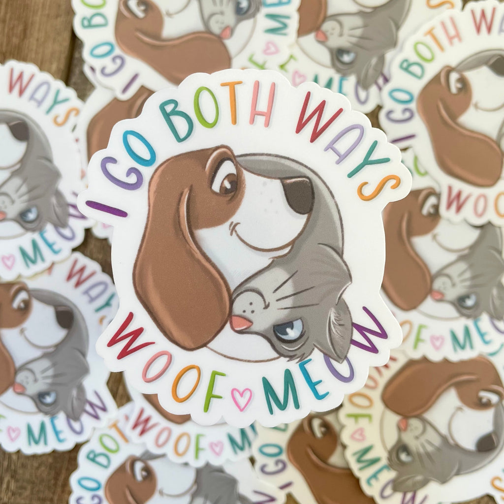 Sticker with a dog and cat design and 'I Go Both Ways Woof Meow' text on a white background.