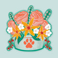 Artwork of a dog dish with paw print filled with orange and pink flowers.
