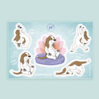 Set of stickers featuring a dog in various  yoga poses on a light blue background.