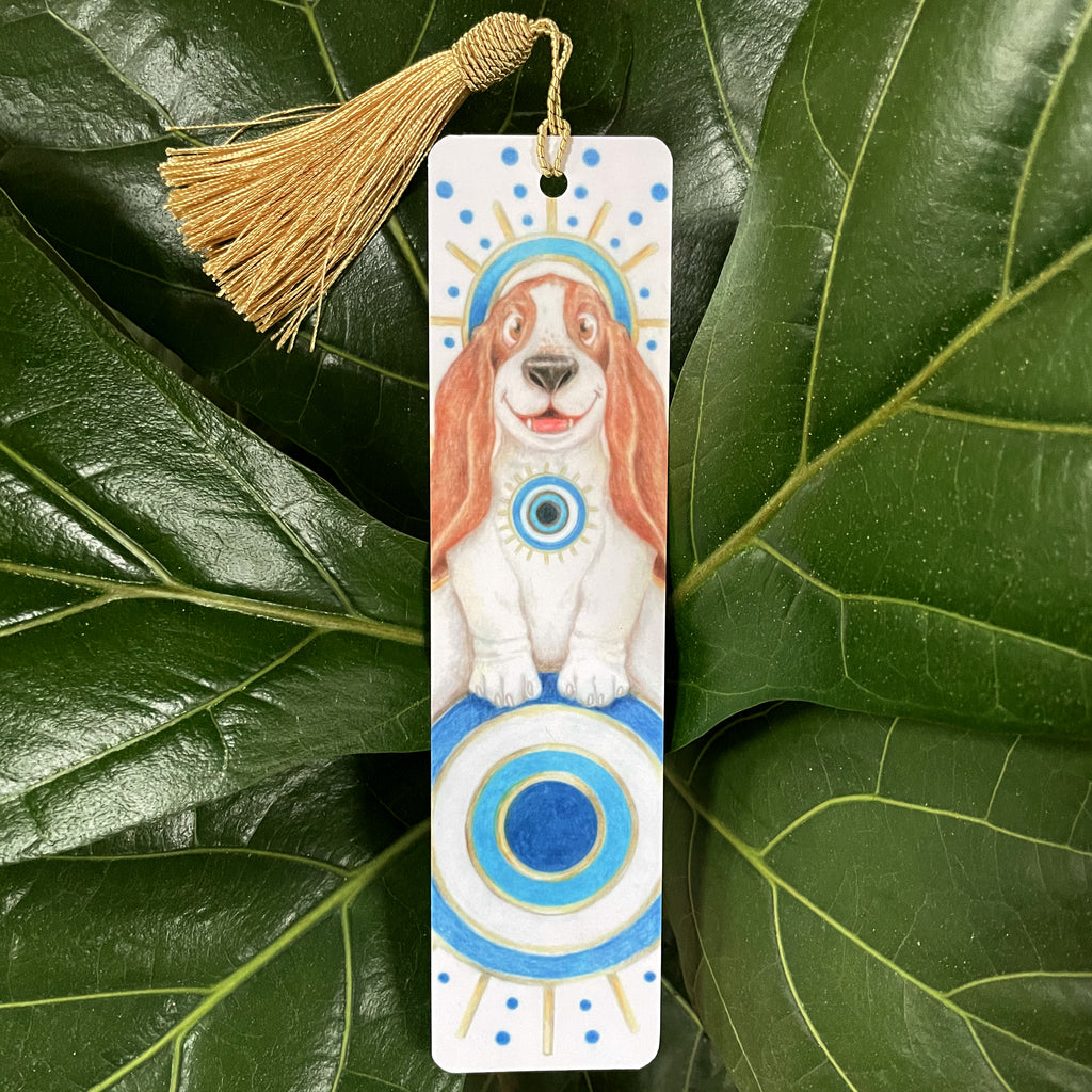Bookmark with a dog illustration on a green leaf background