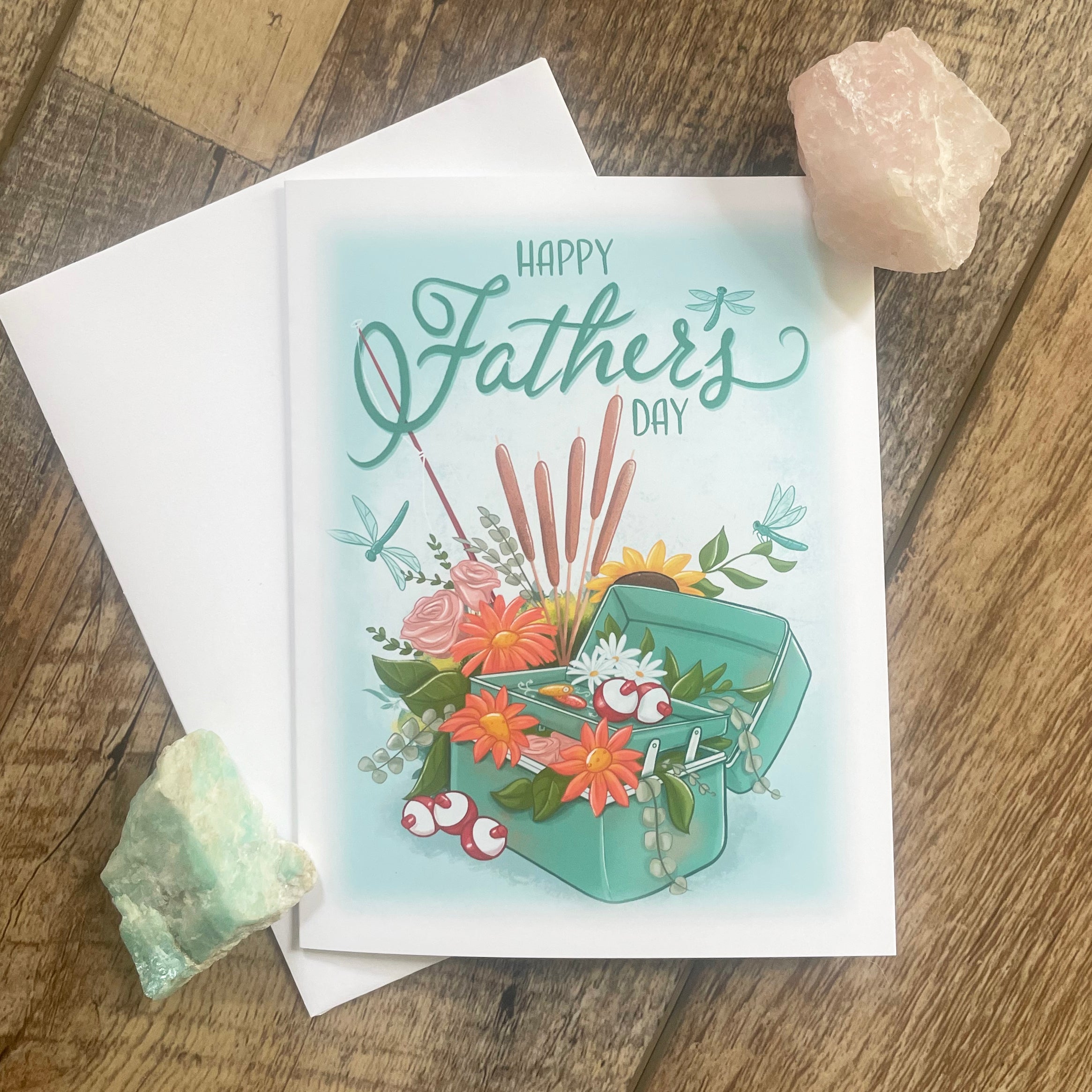 Father's Day card with floral design on a wooden surface.