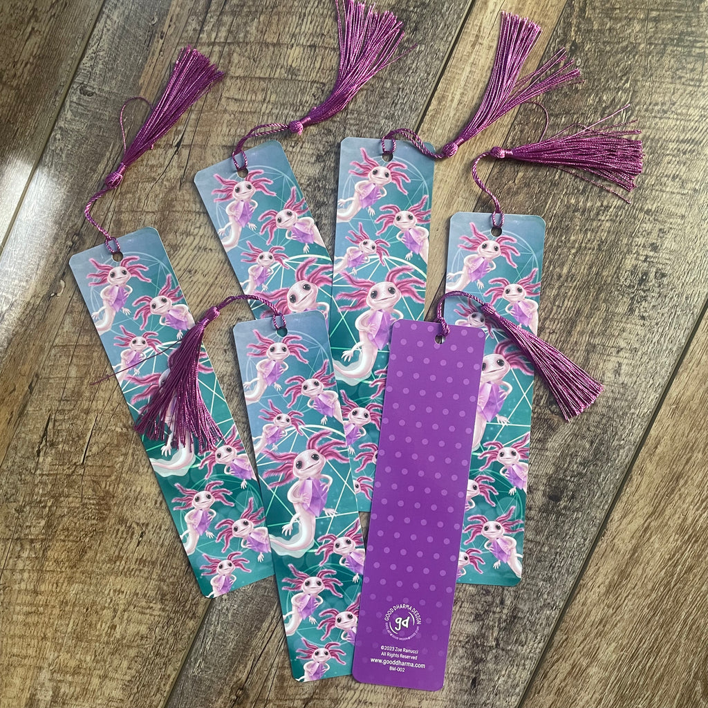 Set of colorful bookmarks with tassels on a wooden surface